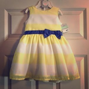 Dress with attached bow